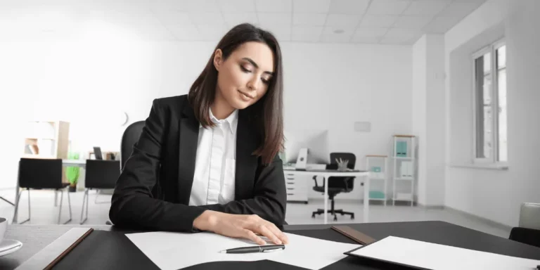 a female attorney reviewing an ERISA plan document in a personal injury case.